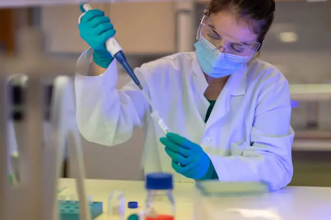 Laboratory scientist preparing a specimen for molecular testing